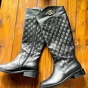 Tall black Gucci designer boots